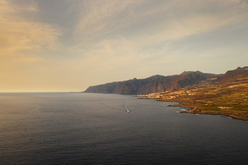 Fototapeta na wymiar view of the coast of the island of Tenerife, a ship sailing in the distance