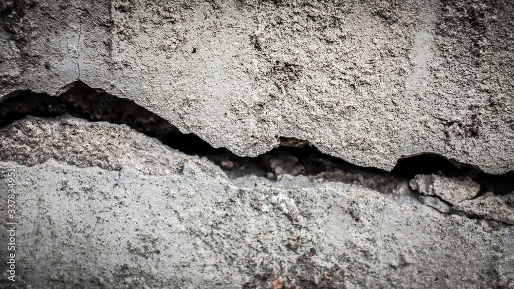 Poster old stone wall with a crack. texture for design