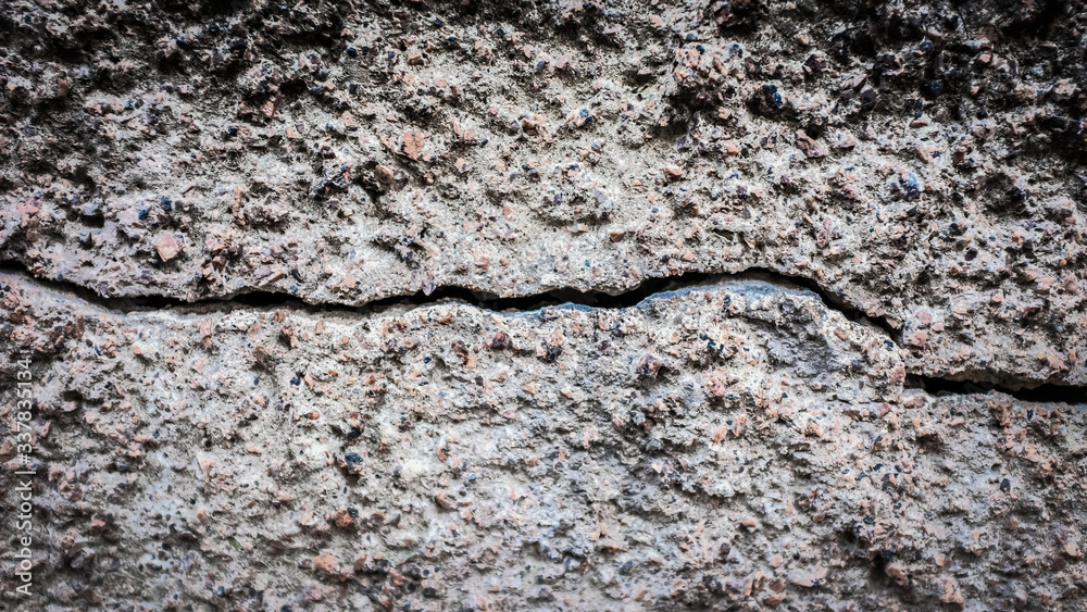 Poster old stone wall with a crack. texture for design