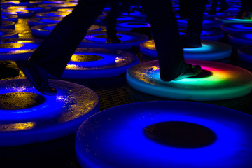 walking on the road with colorful light