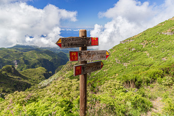A route and direction indicator on a hiking trail in the mountains of Madeira, Portugal.