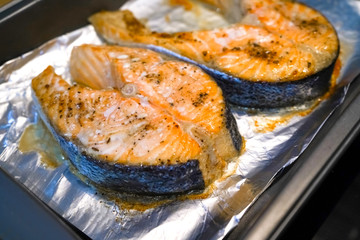 Baked salmon in the oven. Tasty and juicy grilled red fish