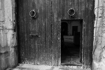 Fototapeta na wymiar Old wooden and metal portal with lock. Vintage artistic design