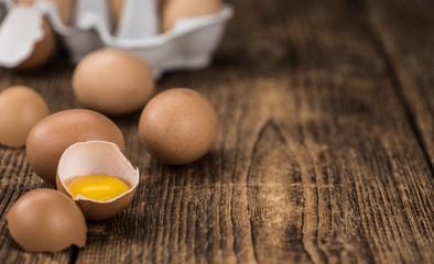 Raw Eggs on an old wooden table (selective focus)