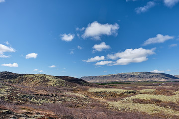 The Icelandic landscape seen from the rim at top of Kerid Volcano crater