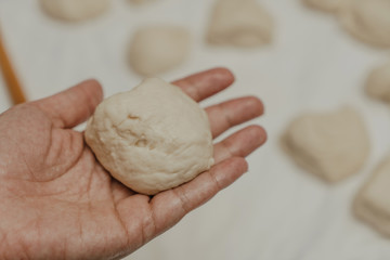 Muslim woman in isolation making bread for meal during holy month Ramadan