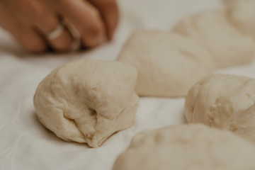 Muslim woman in isolation making bread for meal during holy month Ramadan