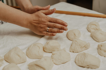 Muslim woman in isolation making bread for meal during holy month Ramadan