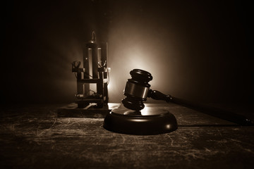 Fototapeta na wymiar Death penalty electric chair miniature on dark. Creative artwork decoration.