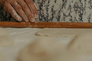 Muslim woman in isolation making bread for meal during holy month Ramadan