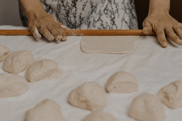 Muslim woman in isolation making bread for meal during holy month Ramadan