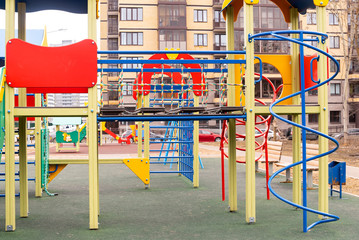 Fototapeta na wymiar Empty children's game complex in the city park in overcast weather
