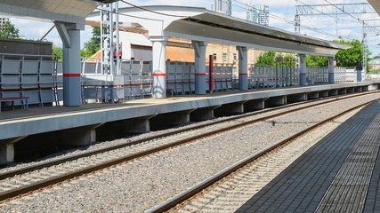 Fototapeta premium Empty railway platform during the Covid-19 coronavirus pandemic. Railway platform is empty due quarantine. No people.