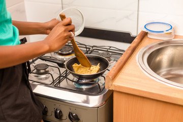 Black African American couple preparing food in the kitchen