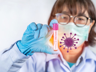 Close up test tube infected blood sample for blood testing diagnosis coronavirus covid-19 in hand physician with germs during analyzing research vaccine coronavirus disease in laboratory 