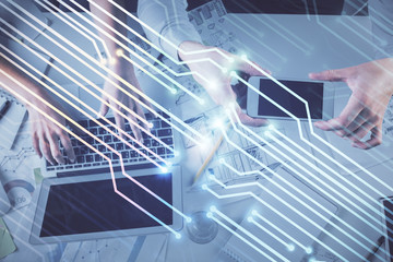 Double exposure of man and woman working together and data theme hologram drawing. Computer background. Top View.