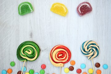 colorful candy on a wooden background