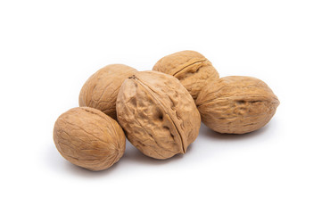 Ripe five whole walnuts, isolated on white background
