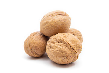 Ripe four whole walnuts, isolated on white background