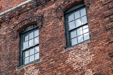 Brick wall on old factory with two windows