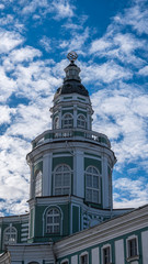 Fototapeta na wymiar The upper tiers of the Kunstkamera tower in St. Petersburg against the blue sky
