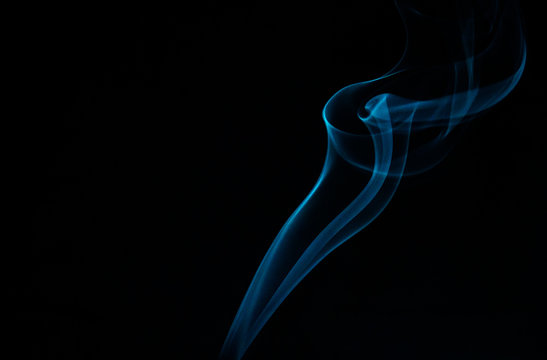 Close-up Of Smoke Against Blue Background