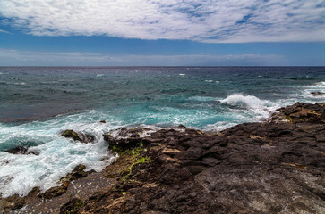 stonesl beach under blue sky