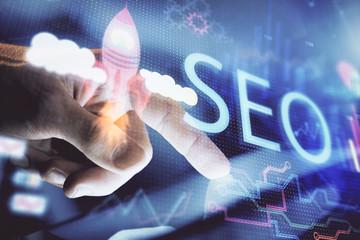 Multi exposure of man's hands holding and using a digital device and seo drawing. search...