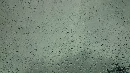 Droplets on glass in a rainy weather