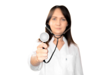 Young woman doctor with dark hair in a white medical coat, with a stethoscope, smiling. Horizontal frame
