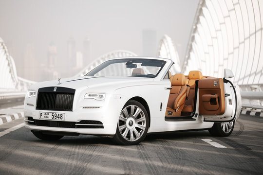Dubai / UAE - October 10 2019: Rolls-Royce Dawn. Cabrio model. Luxury and Success. Dubai car rental. Exclusive car for your life. Leather seats, wooden parts inside. Expo2020 promo