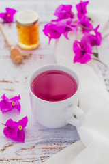 tea of Bougainvillea flowers or te bugambilia with honey and raw flowers and leaves