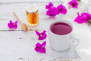 tea of Bougainvillea flowers or te bugambilia with honey and raw flowers and leaves