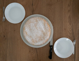 Appetit: A delicious Cheesecake prepared at two plates, ready to cut