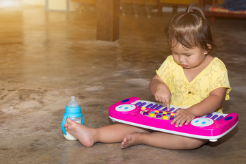 Little girl with electone toy educational games at home,Electone board games for children modern learning,Girl learning about sound tone music