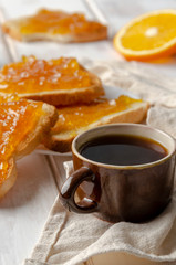 sandwich with fruit jam with espresso cup