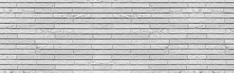 Panorama of white modern stone wall pattern and background