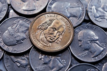 focusing at one dollar united state coins, on Quarter coin background. business and finance concept
