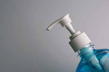 Plastic bottle pump with alcohol hand gel. Hand Sanitizer Antibacterial Cleansing Gel Alcohol Rub that could help protect against coronavirus.