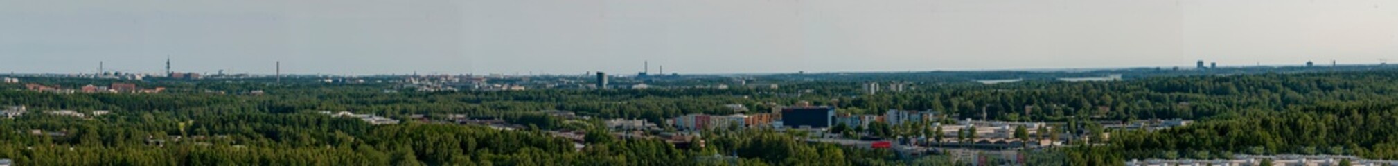 Panaroma view of landscape. Helsinki Finland from a hill. Idustrial capital in middle of forests. 