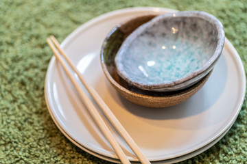 Glazed terracotta cups and Japanese wooden chopsticks