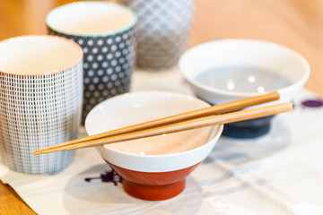 Glazed terracotta cups and Japanese wooden chopsticks
