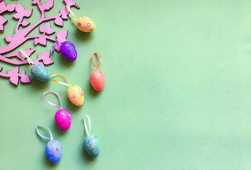 Colorfull eggs on color background symbolize joy and hippieness of great Easter Holiday.