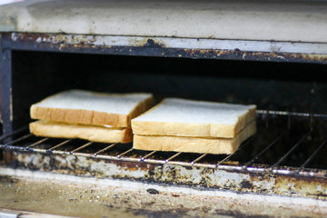 White breads in stove for breakfast.