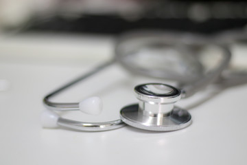 Stethoscope isolated equipment on white texture with blurred background