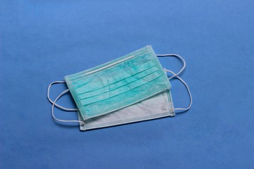 Photo, Light Green Surgical mask at white background for prevention from covid-19 and other virus...