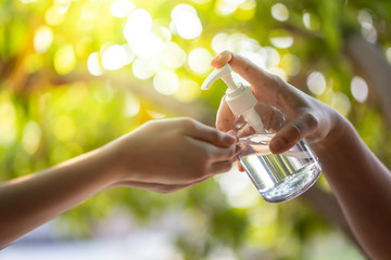 Washing hands by alcohol sanitizers.