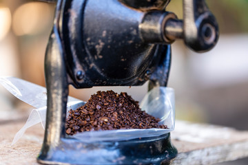 Ground coffee in the manual grinder