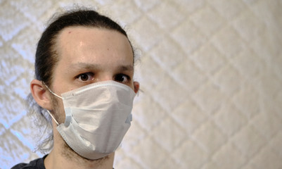 a man in a medical mask on a white background coronavirus