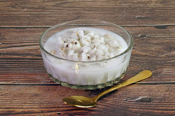 Job’s tear in coconut milk, Asian dessert. Job's tears also known as adlay or adlay millet, Chinese pearl barley, coixseed, tear grass and Yi Yi. Sweet and delicious dessert, Selective focus.